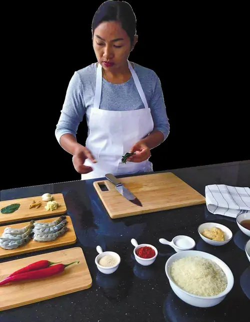 Chef Atitaya Paitoon preparing fresh ingredients at Baan Ya Jai